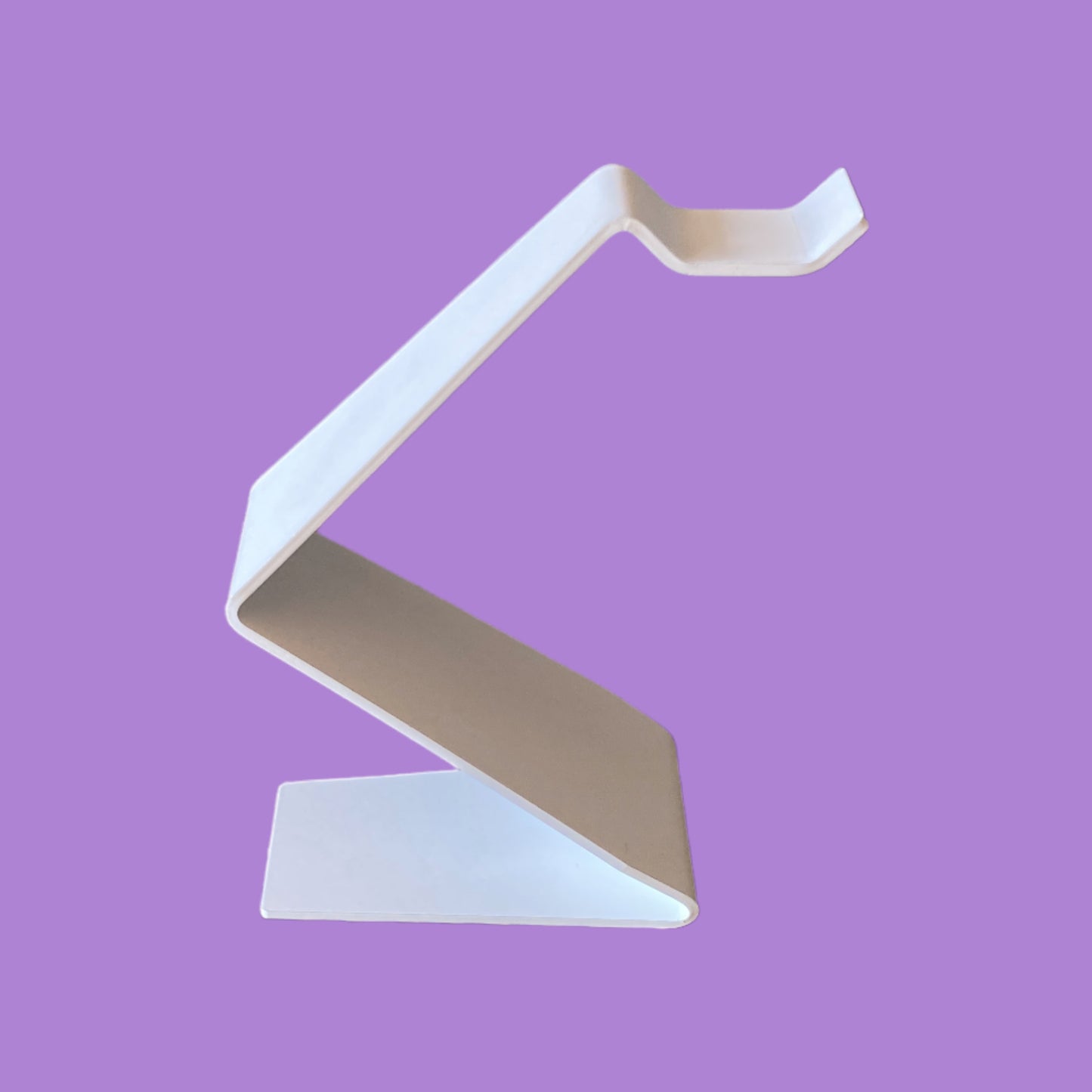 Matte white headphone stand.