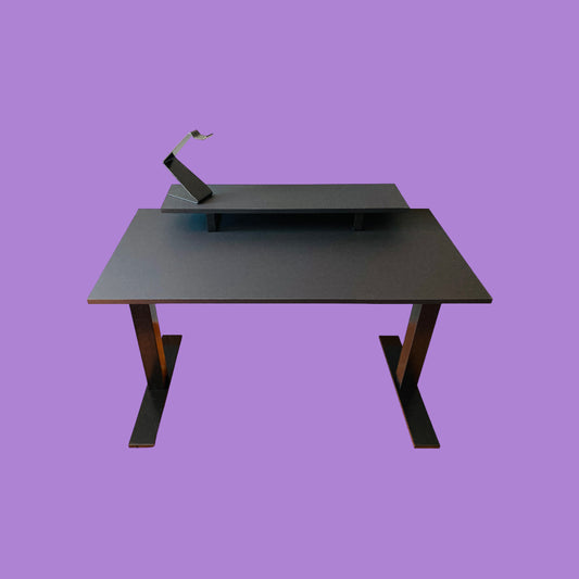Matte black desk with a matte black desk frame and a matte black monitor riser with a matte black headphone stand.